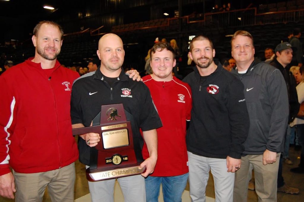 From left to right, coaches Matt Surber, Shane Head, Dustin Mason, Bobby Williams, and Matt Crumley celebrate Tuttle Wrestling's 2018 Dual State Championship. Surber will be inducted into the Oklahoma Coaches Association Hall of Fame Saturday, July 26 at 6:30 p.m. at the Southern Hills Marriott Hotel, located at 1902 East 71st Street in Tulsa. file photo