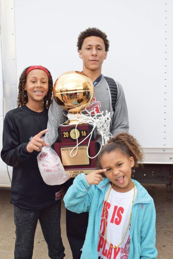 Jaden and Hadyn Harrell celebrate after their older brother Mason helped Carl Albert win a state title in 2016. Photo provided