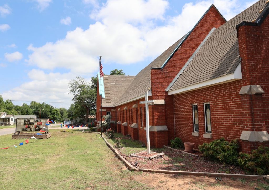Volunteers help replace the roof at Del City Nazarene Church. Photo by Jeff Harrison