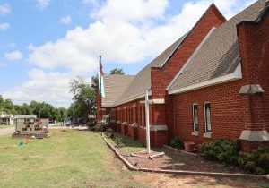 Volunteers help replace the roof at Del City Nazarene Church. Photo by Jeff Harrison