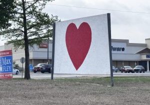 Mysterious red heart signs have popped up around the Midwest City area. Photo by Jeff Harrison