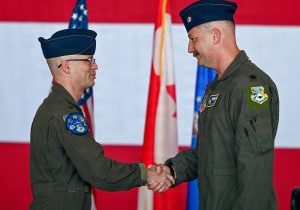 U.S. Air Force Col. James Capra, 552nd Operations Group commander, left, congratulates Lt. Col. Blake Wiegmann after Wiegmann assumed command of the 965th Airborne Air Control Squadron during a change of command ceremony at Tinker Air Force Base, Oklahoma, June 5, 2026. U.S. Air Force photo by Garrett N. Cole
